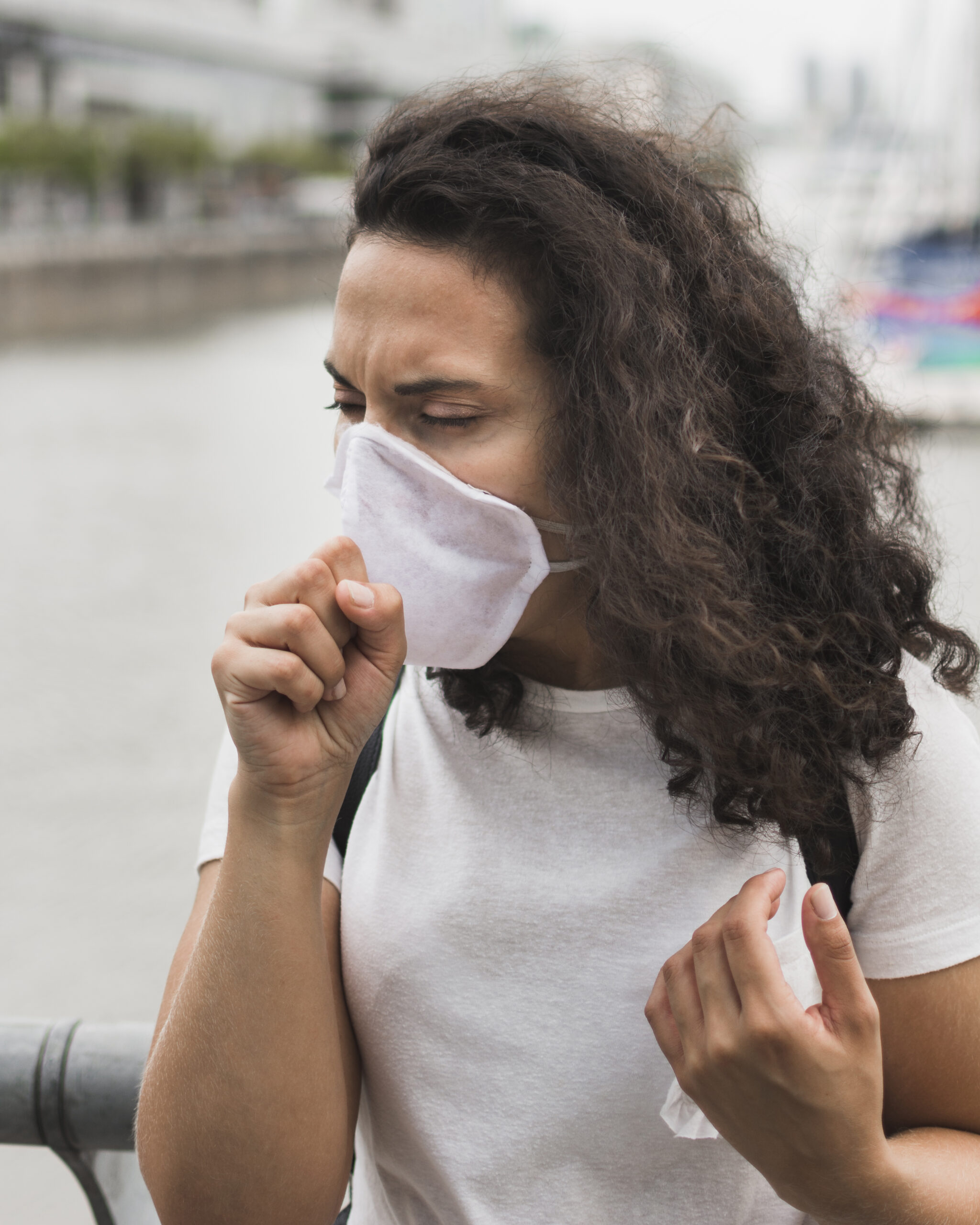 front-view-woman-wearing-medical-mask-while-coughing